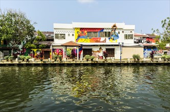 Brightly painted house fronts along the Malacca River
