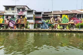 Brightly painted house fronts along the Malacca River