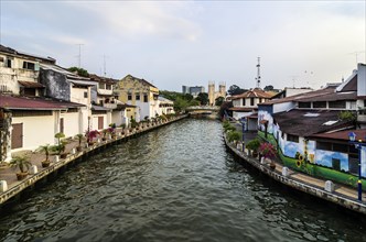 Brightly painted houses along the Malacca River