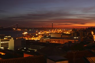 View from Miradouro de Santa Catania on the Bairro Alto and Ponte 25 de Abril at dusk