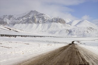 Oil pipeline from Prudhoe Bay to Valdez in the Arctic winter along the Dalton Highway