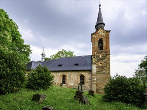 Exterior view of the ghost church of Lukova with part of the cemetery