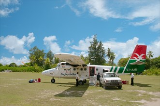 A small plane of Seychelles airlines on the runway