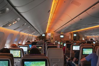 Boeing 777-300 passenger compartment economy class during flight Dubai-Frankfurt