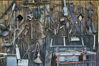 Old tools on a shed wall