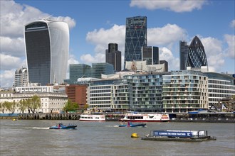 View of the skyline of the City of London with high-rise office buildings and the River Thames