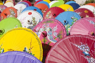 Handmade paper parasols drying in the sun at an umbrella factory in Bo Sang