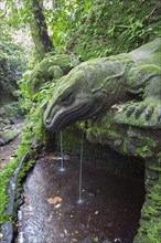 Stone Komodo dragons at Pura Dalem Agung Padangtegal or Monkey Forest Temple