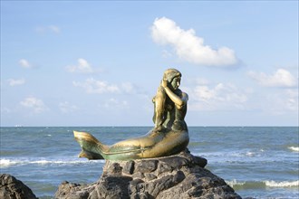 Golden mermaid statue on Samila beach