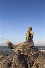Golden mermaid statue on Samila beach