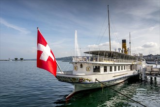 Cruise vessel with swiss flag on Lake Geneva