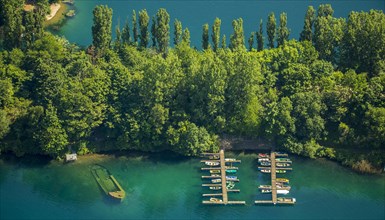 Escher lake with boats docked at a pier