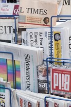 Various newspapers in a news rack