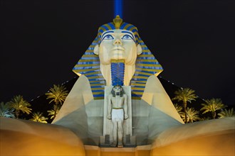 Sphinx pyramid and palms