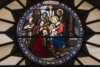 Church window of St. Catherine's Church with birth of Jesus Christ with Mary