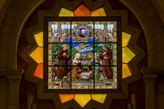 Stained glass window depicting the birth of Jesus Christ in the St. Catherine's Church