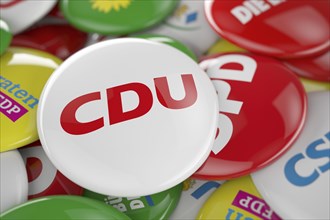 German political party CDU button in front between other governing party buttons