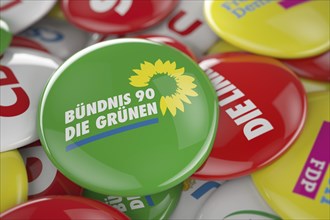 German political party Bundnis 90 Die Grunen button in front between other governing party buttons