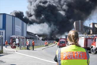 Police officer with safety vest at a major fire