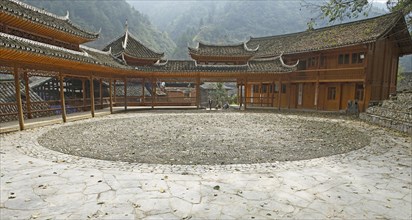 Traditional pagodas line the meeting place in the Miao village of Langde
