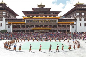 Dancers and spectators at the Tashichho Dzong monastery festival
