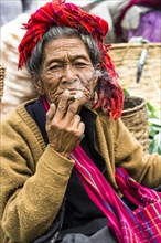 Smoking old woman from the Pao hilltribe or mountain people