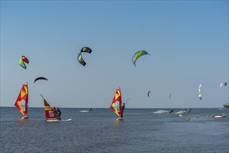 Kitesurfers and windsurfers