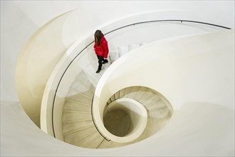 Woman on spiral staircase