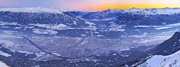 Innsbruck covered in snow at dusk