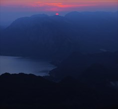 Sunrise over Attersee or Lake Atter and Hollengebirge mountain range
