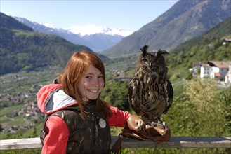Girl with a Eurasian eagle-owl
