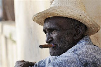 Man with cigar and straw hat