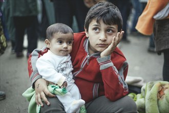 Boy from Syria after arriving with his little brother