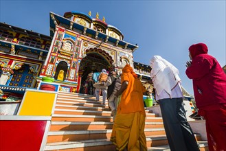 Pilgrims entering the colourful Badrinath Temple