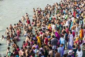 Masses of pilgrims are gathering for bathing at Harki Pauri Ghat at the holy river Ganges
