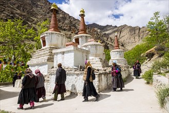 Local pilgrims are walking around a Chorten in a small valley above Hemis Gompa