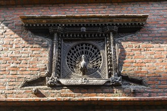 Carved wooden Peacock Window at a house