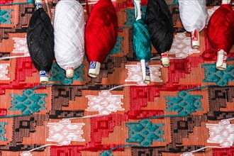 Colorful threads for weaving the Dhaka topi