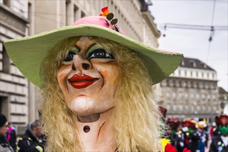 Portrait of a woman wearing a fancy dress and a mask at the great procession at the Carnival of Basel