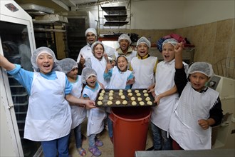 Children and teachers in bakery