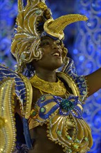 Samba dancer on an allegories float dressed as a Hummingbird