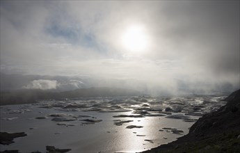 Glacial lake in fog