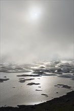 Glacial lake in fog