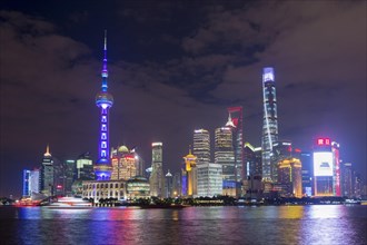 Pudong financial district with Oriental Pearl Tower at night