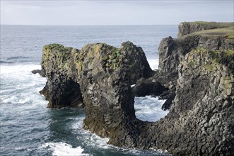 Lava rock in sea at coast