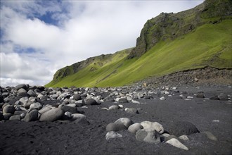 Lava beach with sand and stones