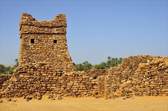 Ruins and minaret of the fortified trading post or Ksar