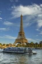 Eiffel Tower with passenger ferry Bateaux Mouches on the Seine