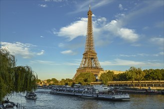 Eiffel Tower with passenger ferry Bateaux Mouches on the Seine