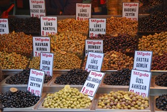 Several varieties of olives at a market stall